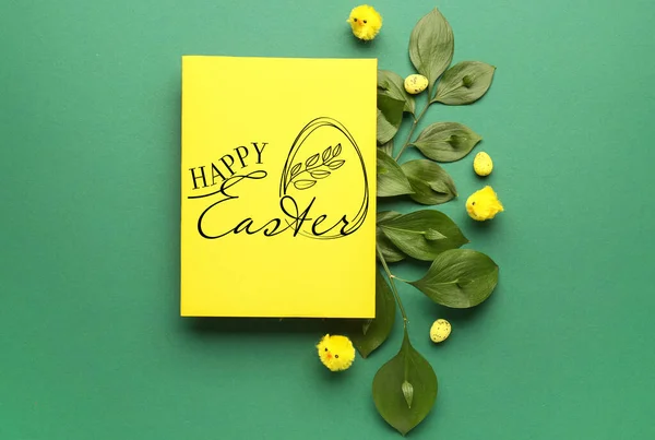 Easter greeting card, toy chickens and painted eggs on green background