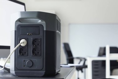 Portable power station on table in office