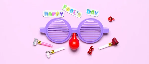 Text Happy Fool Day Funny Disguise Noisemakers Lilac Background — Foto de Stock