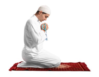 Praying Muslim man on white background