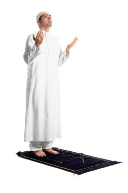 Praying Muslim man on white background