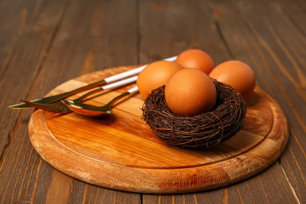 Table Serving Easter Eggs Brown Wooden Background — Zdjęcie stockowe