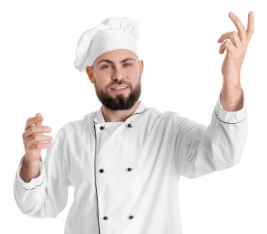 Male baker in uniform on white background