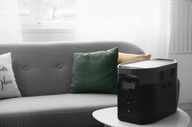 Portable power station on table in living room