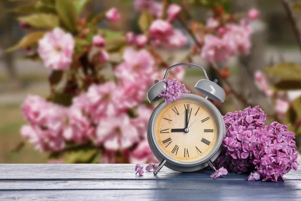 Alarm Clock Flowers Table Outdoors Spring Time — Stock Fotó