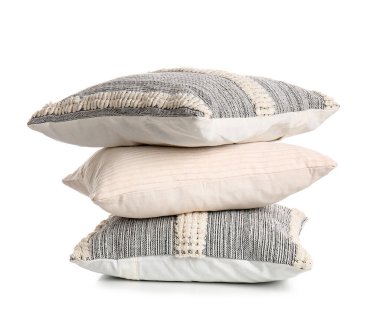Stack of decorative pillows on white background