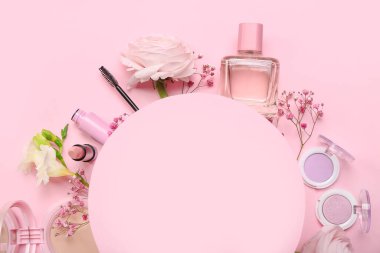 Composition with blank card, cosmetics and flowers on pink background, closeup