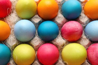 Cardboard holder with painted Easter eggs, closeup