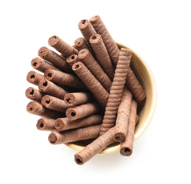 Bowl with delicious chocolate wafer rolls isolated on white background