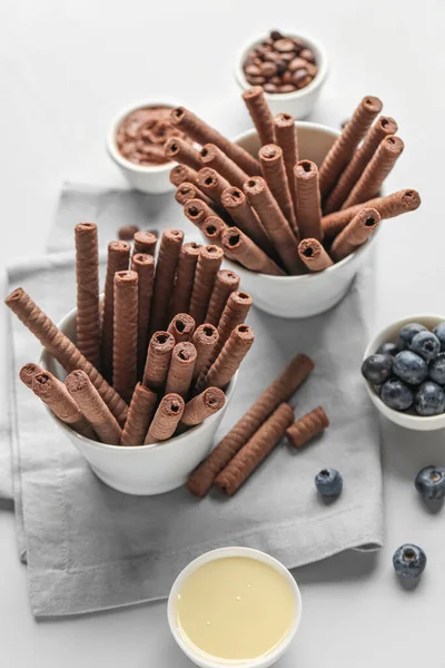 Composition Delicious Chocolate Wafer Rolls Blueberries Condensed Milk Grey Background — Stock Photo, Image