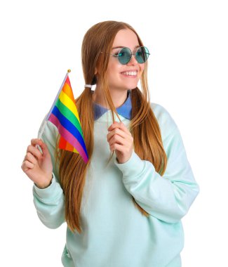 Beautiful young woman in sunglasses with LGBT flag on white background