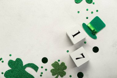 Frame made of paper decor and sequins on white background. St. Patrick's Day celebration