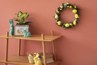 Easter wreath hanging on color wall in living room