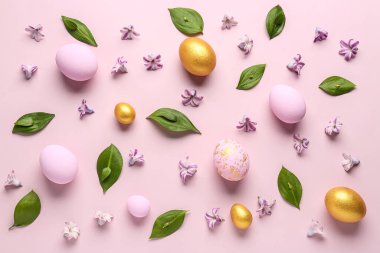 Composition with Easter eggs, plant leaves and flowers on color background
