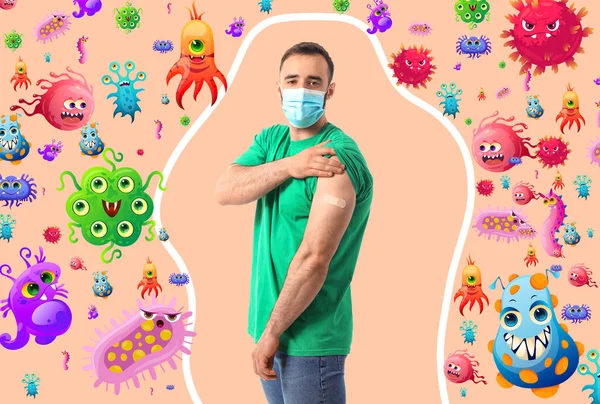 Man with applied medical patch on shoulder against beige background. Concept of strong immunity