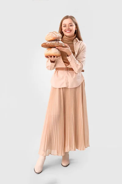 Young Woman Loaves Fresh Bread Light Background — Stock Photo, Image