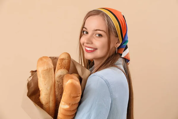 Young Woman Fresh Baguettes Beige Background Closeup — Stock Photo, Image