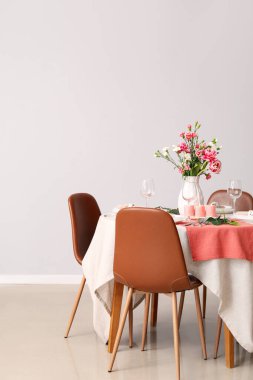Beautiful table setting for International Women's Day celebration in light room