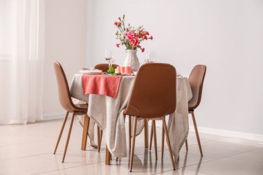 Beautiful table setting for International Women's Day celebration in light room