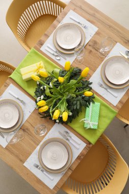 Setting for International Women's Day celebration with flowers and gifts on table