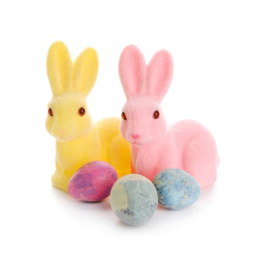 Easter bunnies and painted eggs isolated on white background
