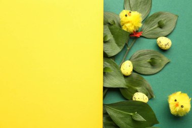 Blank greeting card, Easter eggs and baby chickens on green background