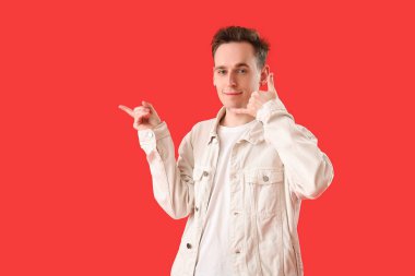 Cool young man showing 