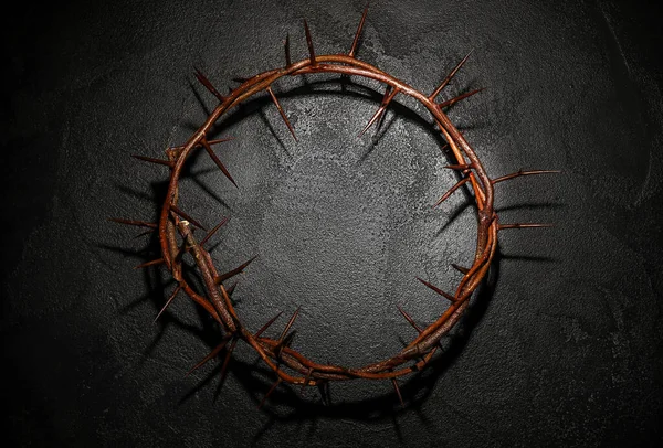 Crown of thorns on dark background, top view