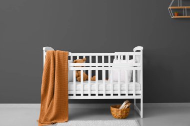 White crib in modern children's room interior