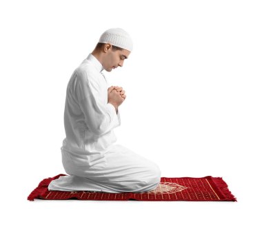 Praying Muslim man on white background