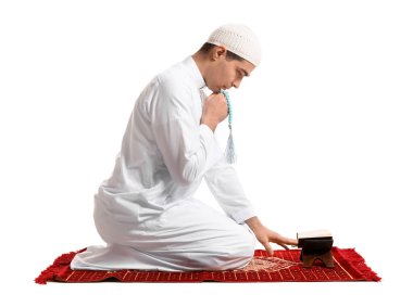 Praying Muslim man on white background
