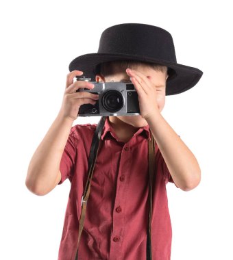 Cute little photographer with camera on white background