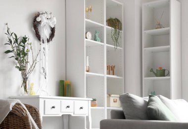 Easter wreath hanging on light wall in living room