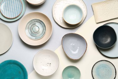 Composition with dishes on grey and white background