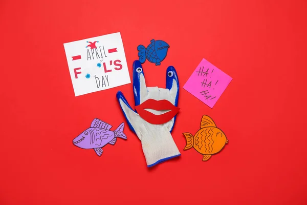 Creative Composition Glove Card Paper Fishes Red Background April Fool — Stock Fotó