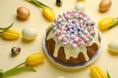 Composition with sweet Easter cake, eggs and beautiful tulip flowers on color background