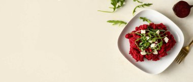 Plate with tasty beet risotto on light background with space for text