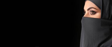 Beautiful Muslim woman on dark background with space for text