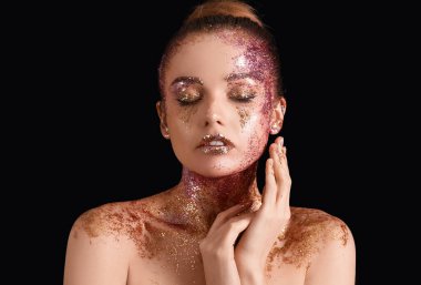 Young woman with glitter makeup on black background, closeup