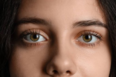 Teenage girl with green eyes, closeup clipart