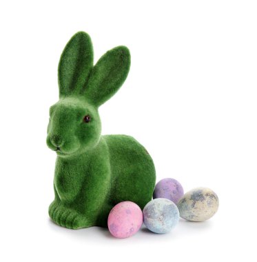 Easter bunny and painted eggs isolated on white background