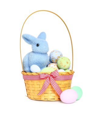 Wicker basket with painted Easter eggs and bunny isolated on white background
