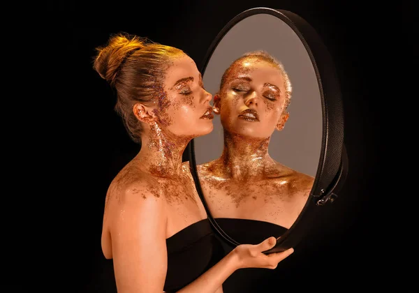 Beautiful Young Woman Glitter Makeup Mirror Dark Background — 스톡 사진