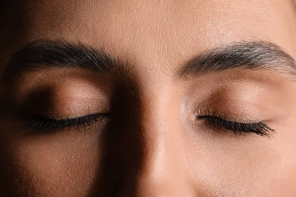 Woman with closed eyes, closeup