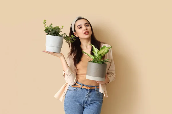 Young Woman Green Houseplants Beige Background — Stock Photo, Image
