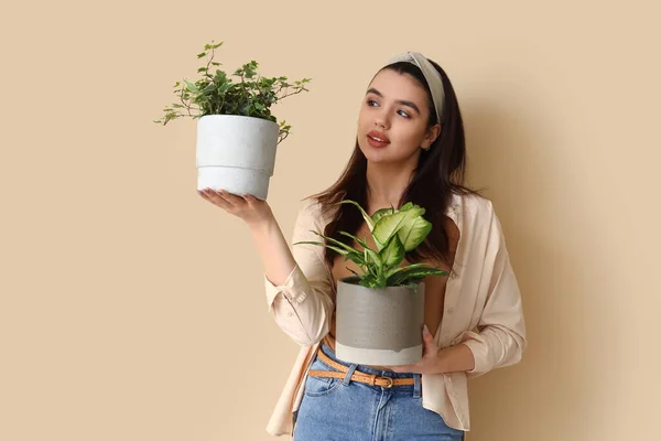 Young Woman Green Houseplants Beige Background — Stock Photo, Image