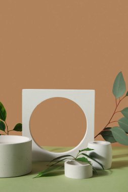 Plaster podiums with eucalyptus and ficus branches on green table against brown background