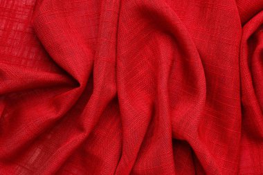 Closeup view of crumpled red fabric as background