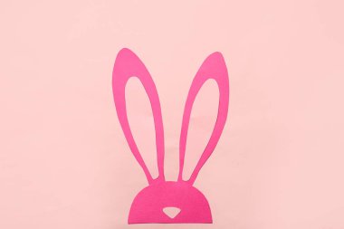 Paper bunny on pink background