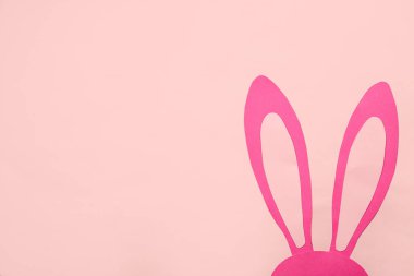 Paper bunny on pink background